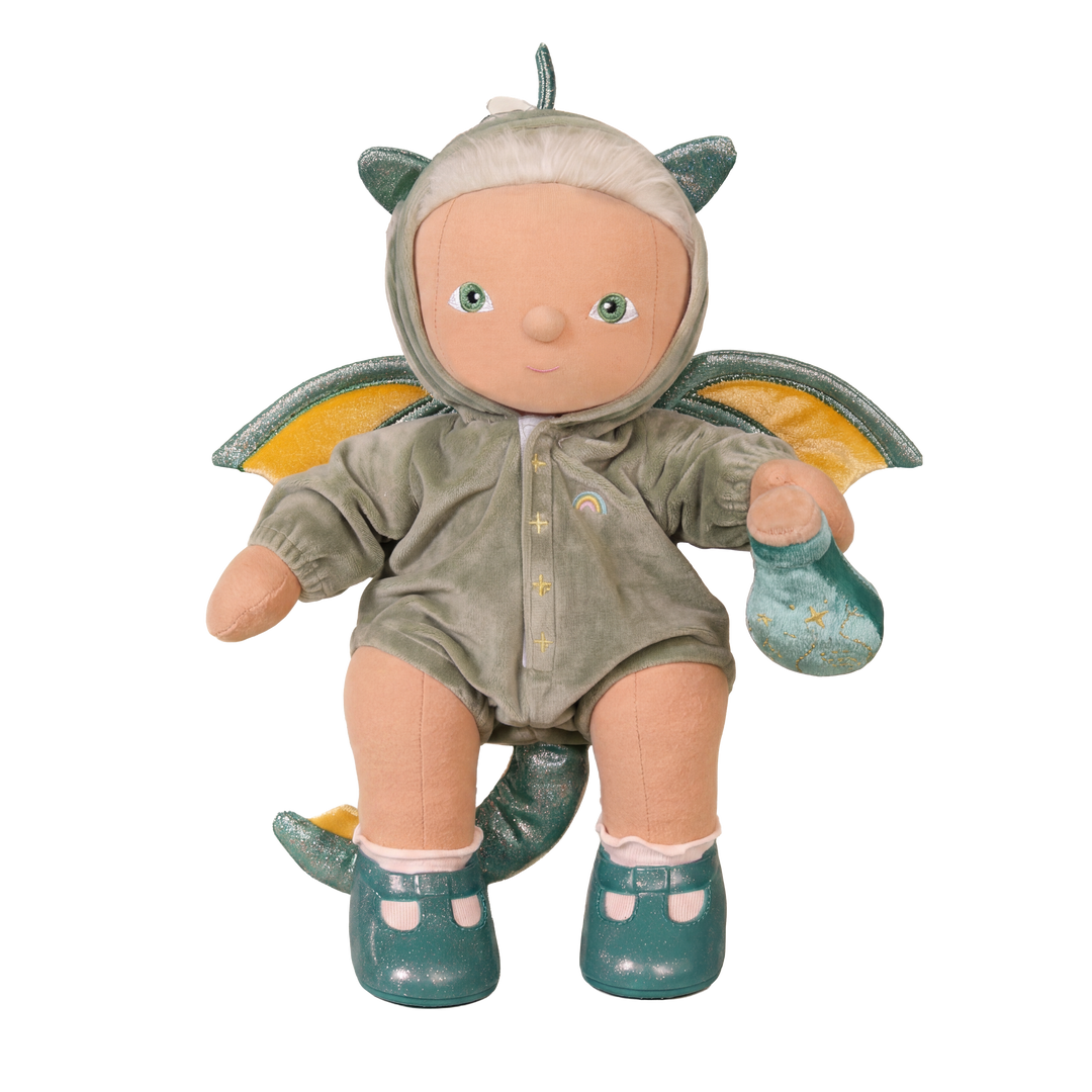 Doll in a dragon costume with wings on a white background